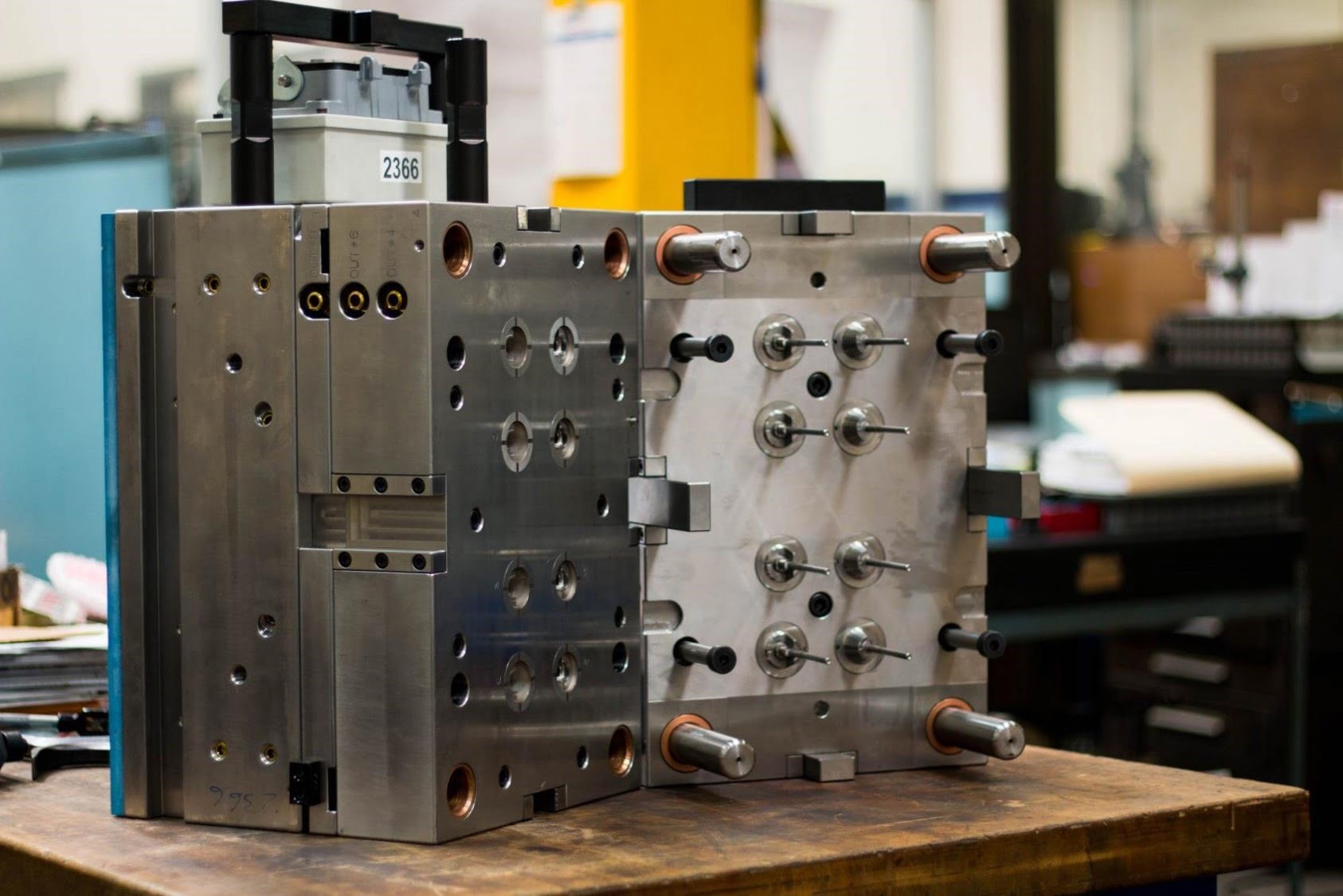 Engineers reviewing a custom plastic mold design from a China plastic mould manufacturer, ensuring precision for startup scalability