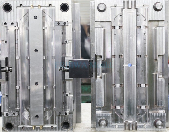 Industrial steel automotive injection mold for vehicle parts production at Uttmould factory.