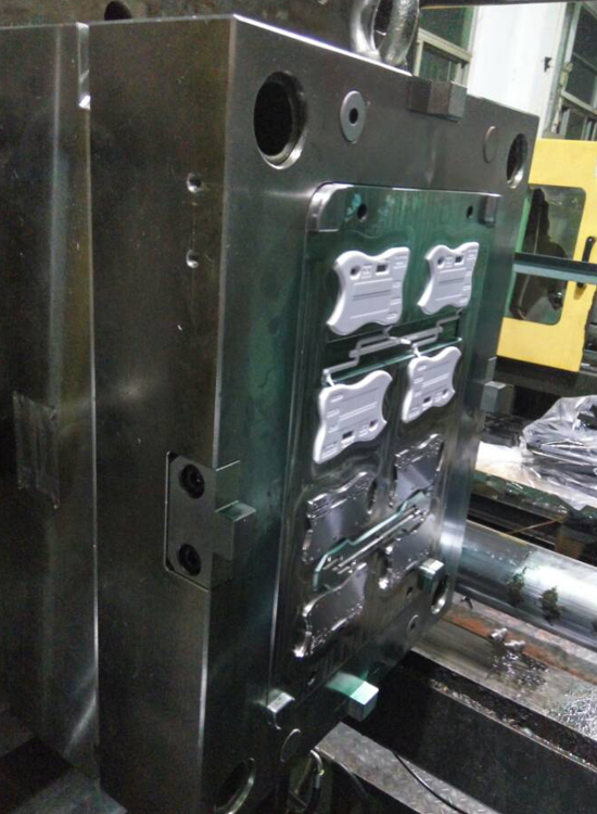 Housing mold installed on an injection molding machine